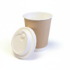 Coffee cup with lid beside