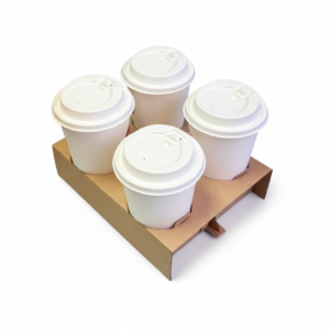 Four white coffee cups in carrier