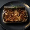 Vegan abalone and double mushroom lotus leaf rice on plate